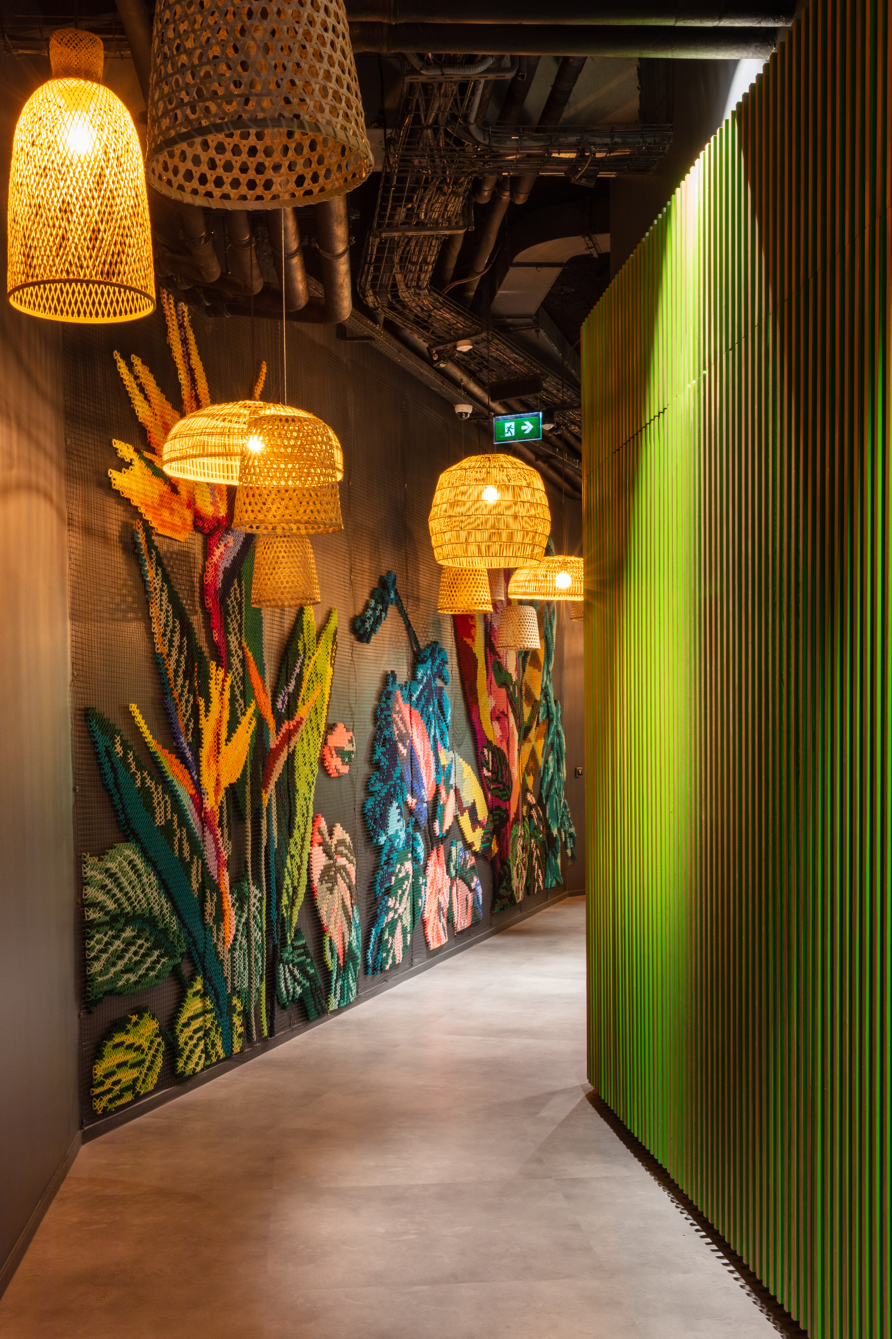 Davidson Consulting Paris — full corridor view of tropical embroidered mural