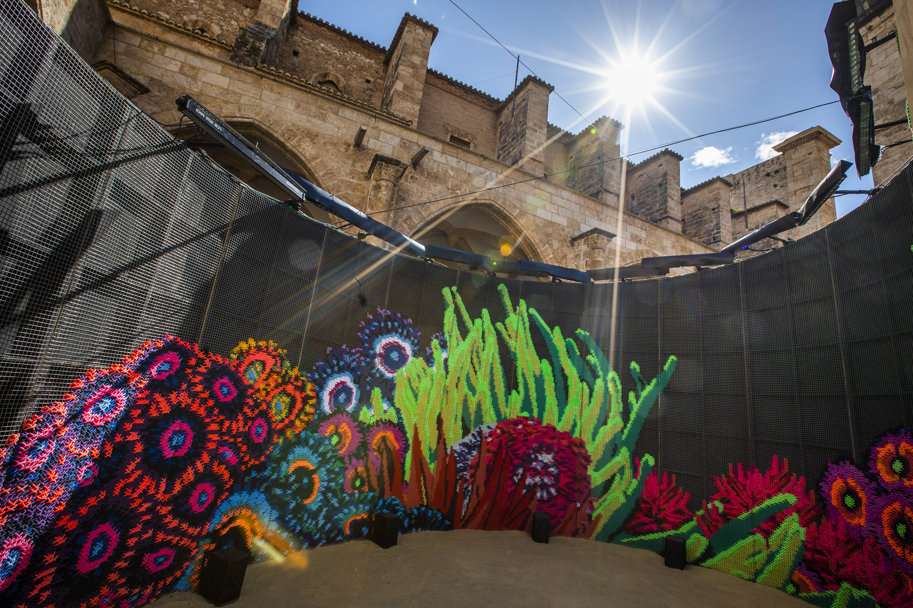 Efluenow — full spiral installation view from inside the cloister by day