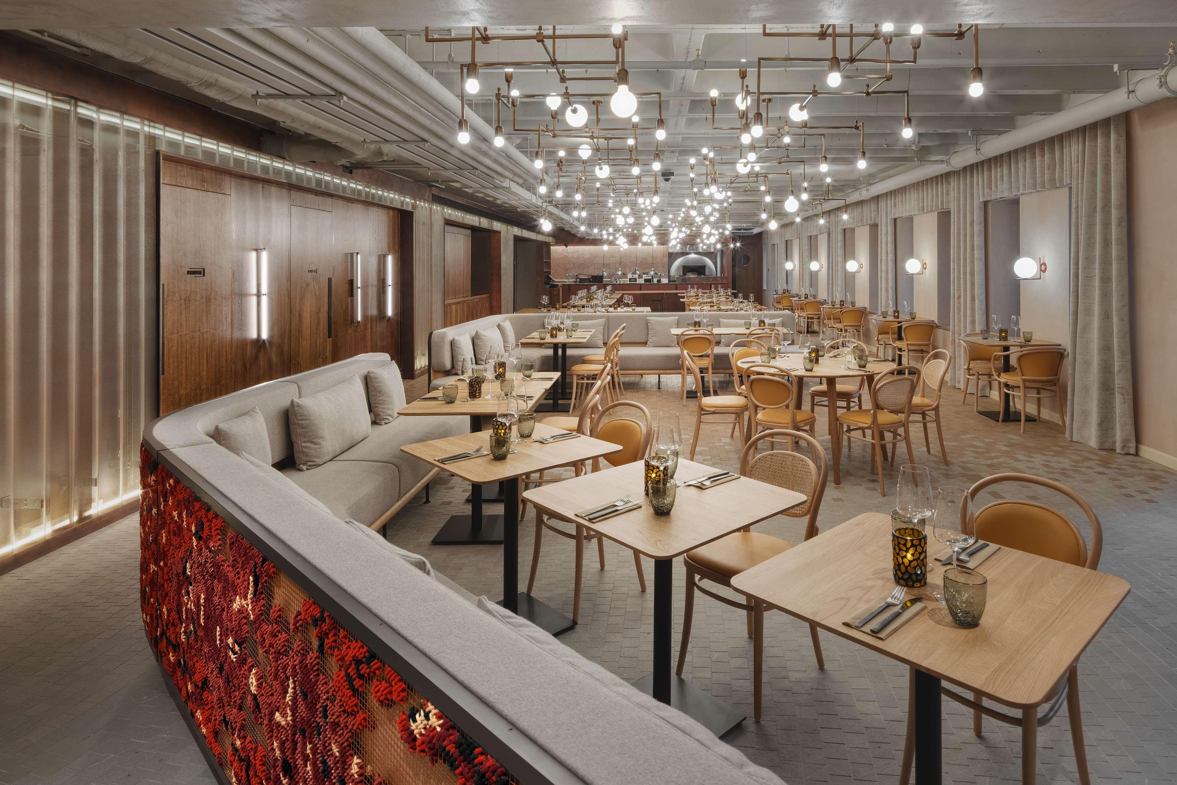 Penny Squares — full view of embroidered curved sofa from above