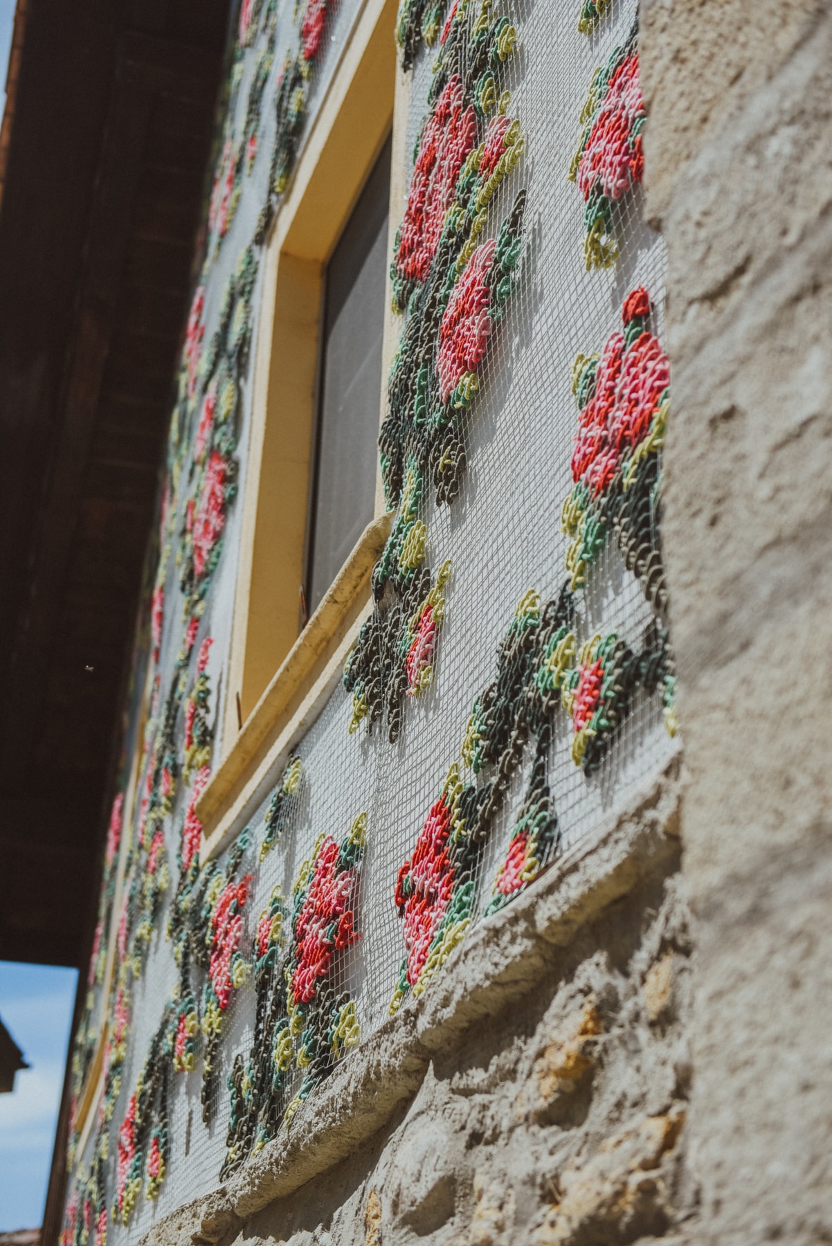 Flores — side perspective detail of embroidered roses on mesh facade