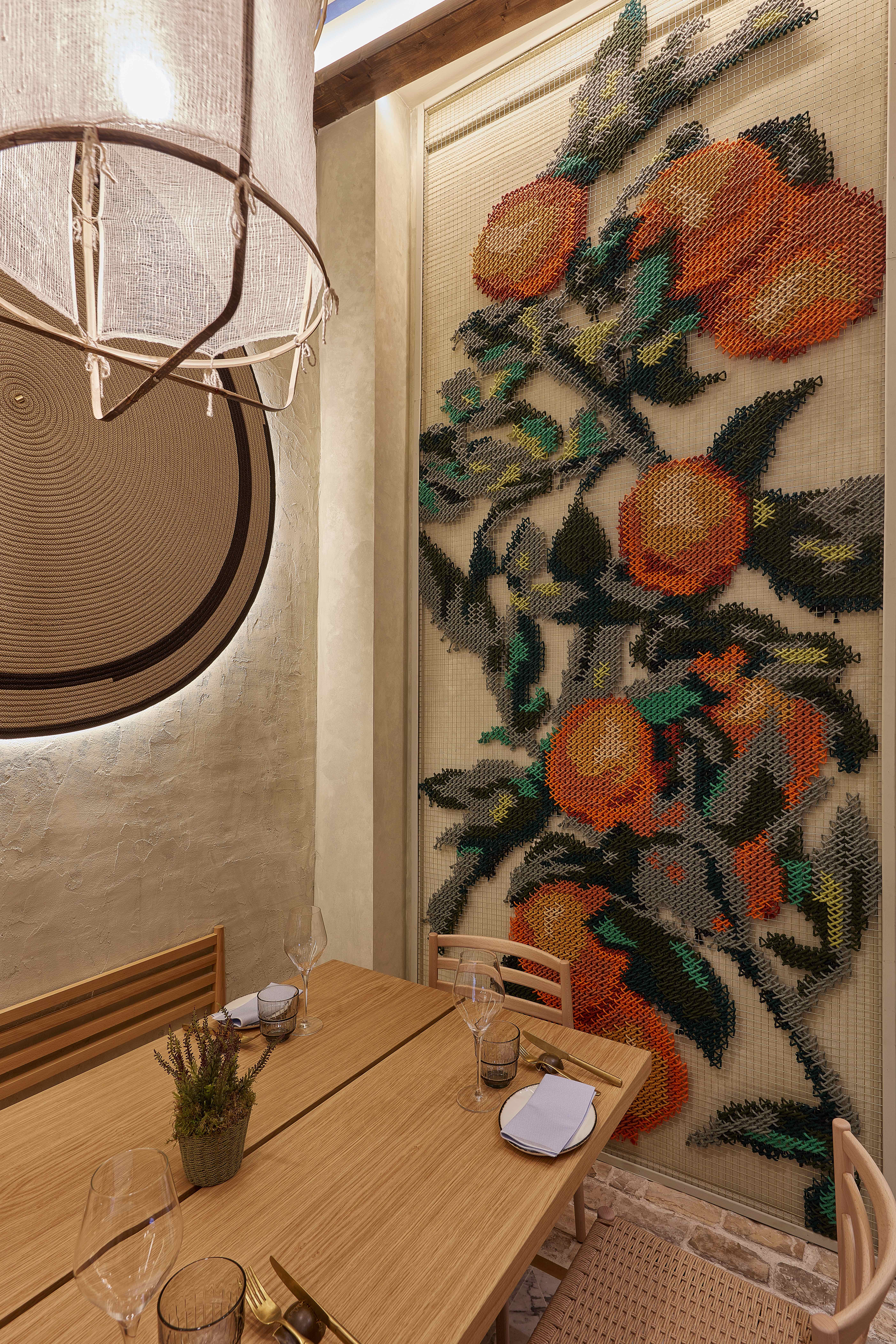 Vaqueta — bar area with Heineken fridge and embroidered wall mural